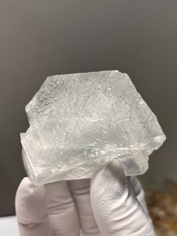 White fluorite octahedron with lace-like pattern from Xuebaoding, Sichuan, China, close-up of the crystal faces
