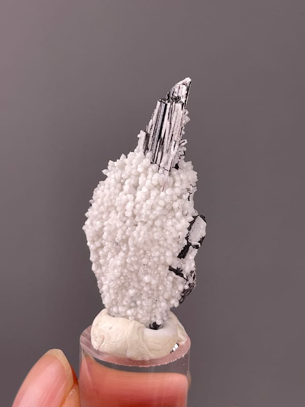 Wolframite-group with Quartz specimen from Yaogangxian, Hunan, China presenting steel-gray bladed crystals on quartz druse