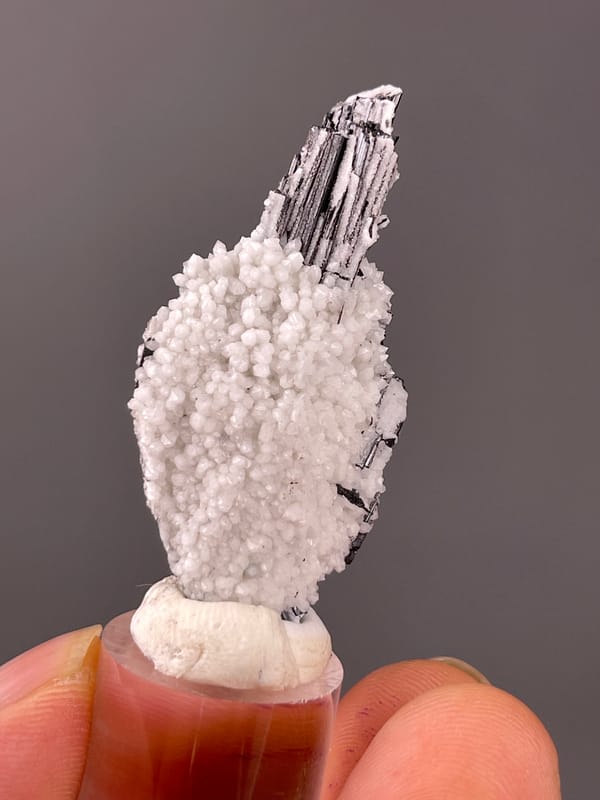 Wolframite-group with Quartz specimen from Yaogangxian, Hunan, China bearing steel-gray bladed crystals on quartz druse