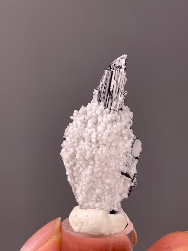 Wolframite-group with Quartz specimen from Yaogangxian, Hunan, China defined by steel-gray bladed crystals on quartz druse