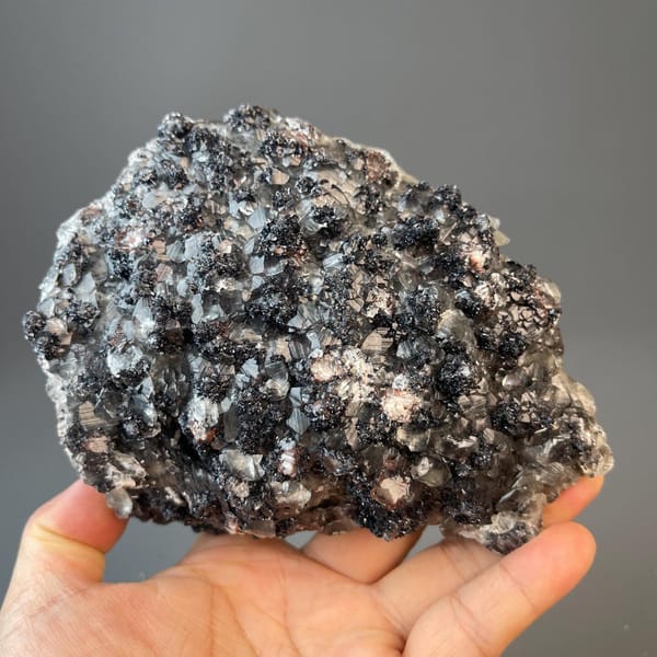 Cabinet-size hematite and calcite cluster, larger than a hand
