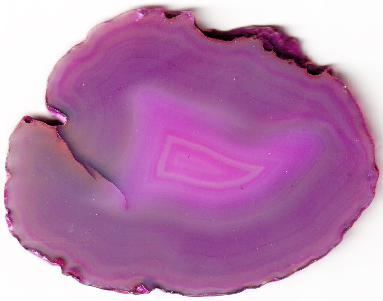 Dyed agate slices — the saturated blues and greens are added colour, not natural banding.