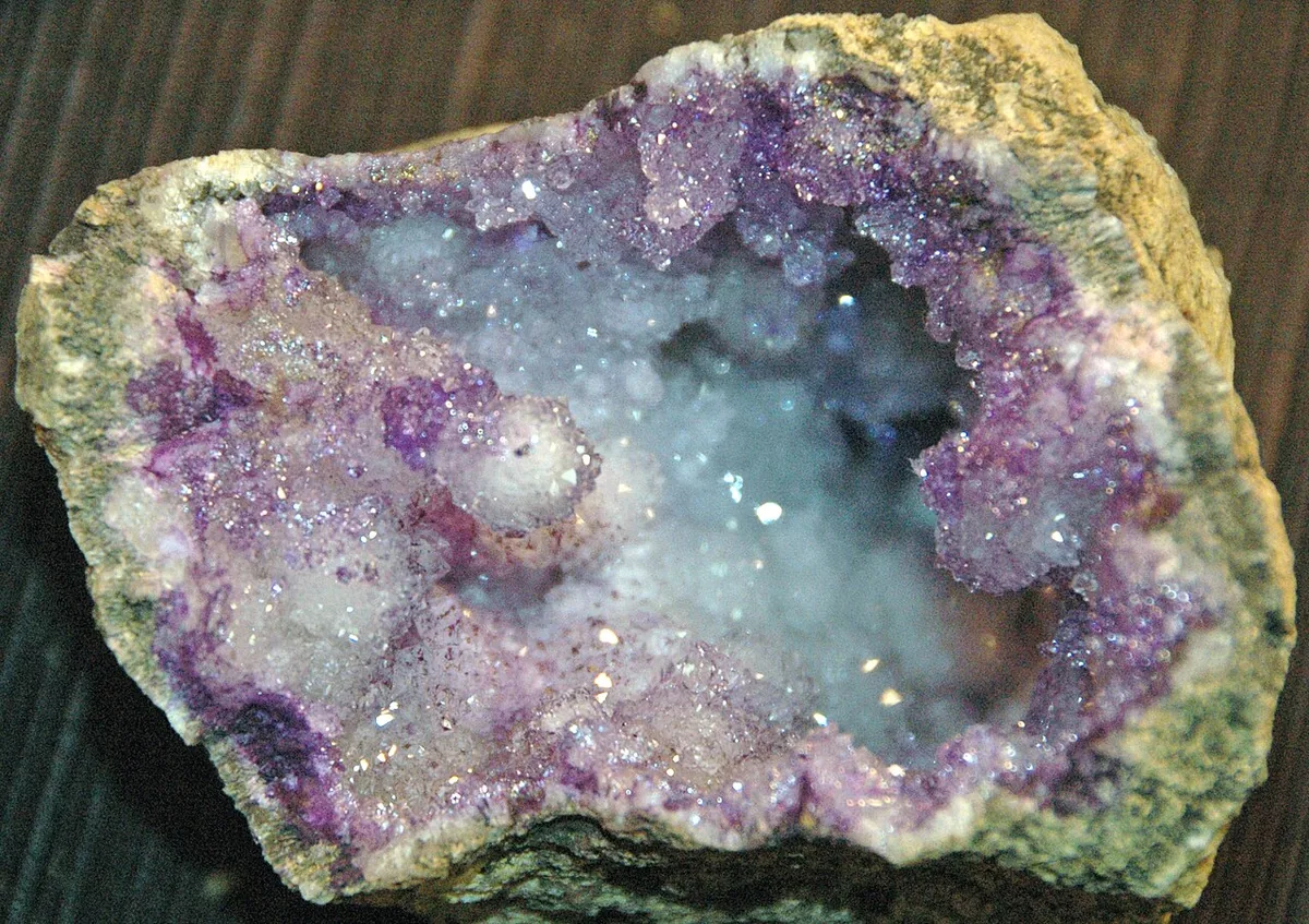 A dyed quartz geode from Morocco sold as natural amethyst — the patchy purple sits on the surface rather than coloring the crystals through.